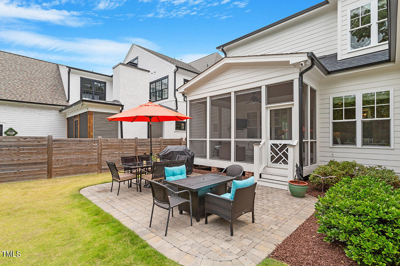 913 Canterbury Road Raleigh, NC 27607 - Photo 34 of 36 a backyard of a house with table and chairs