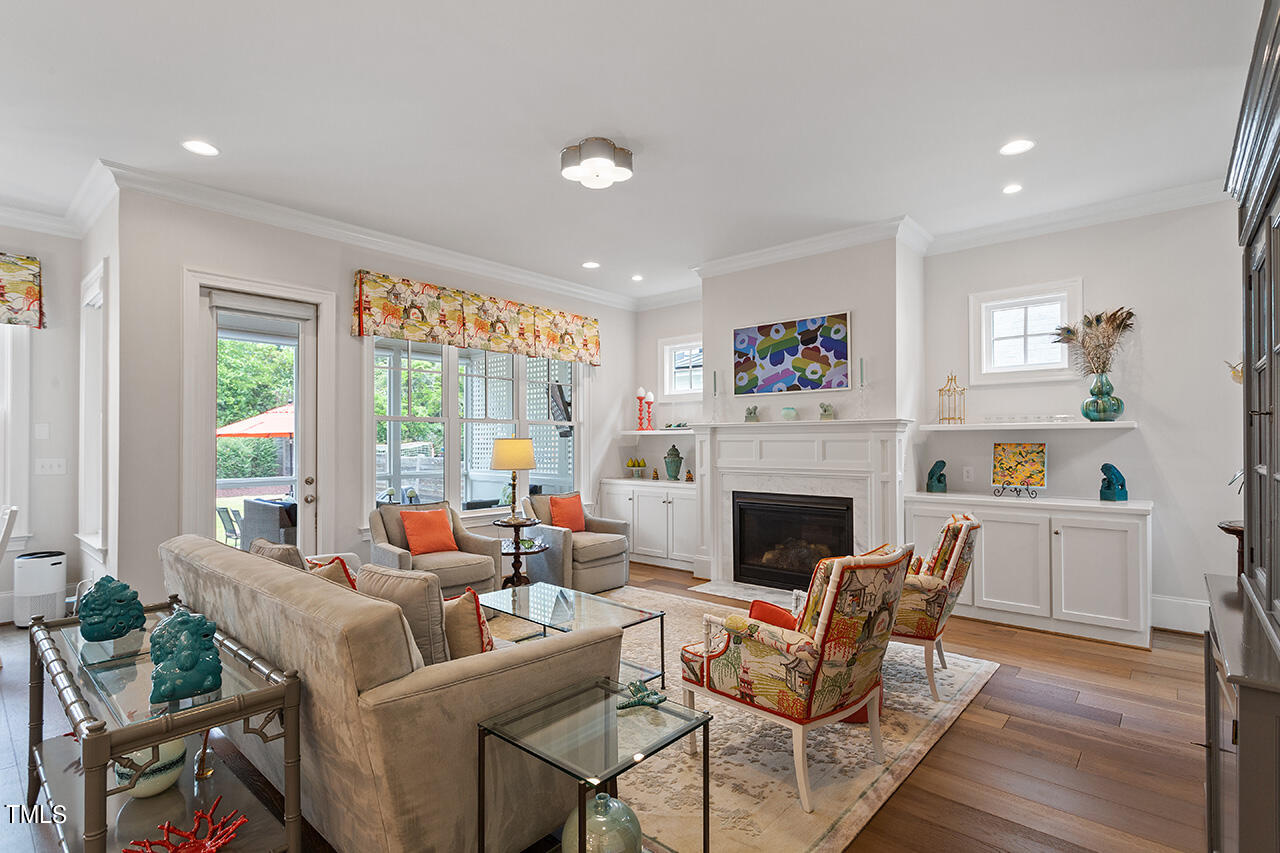 913 Canterbury Road Raleigh, NC 27607 - Photo 6 of 36 a living room with furniture and a fireplace