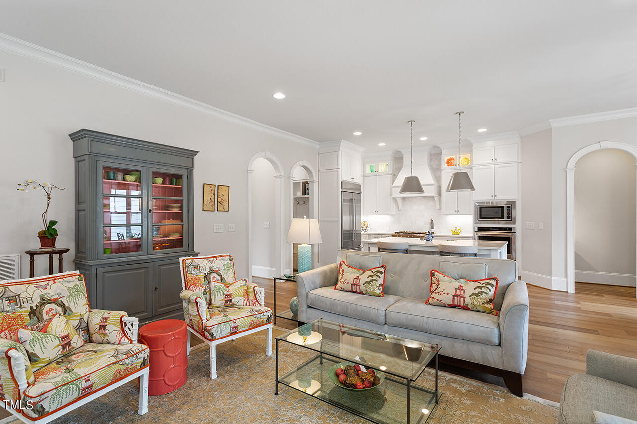 913 Canterbury Road Raleigh, NC 27607 - Photo 8 of 36 a living room with furniture and a large window