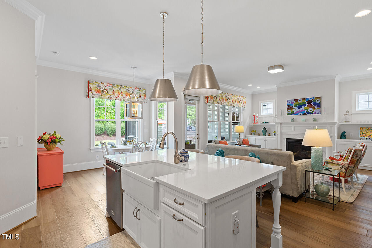 913 Canterbury Road Raleigh, NC 27607 - Photo 10 of 36 a kitchen with sink and view of living room