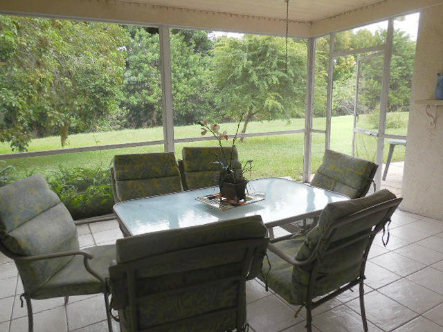 10375 Greenbriar Court Boca Raton, FL 33498 - Photo 27 of 41 SCREENED PATIO VIEW