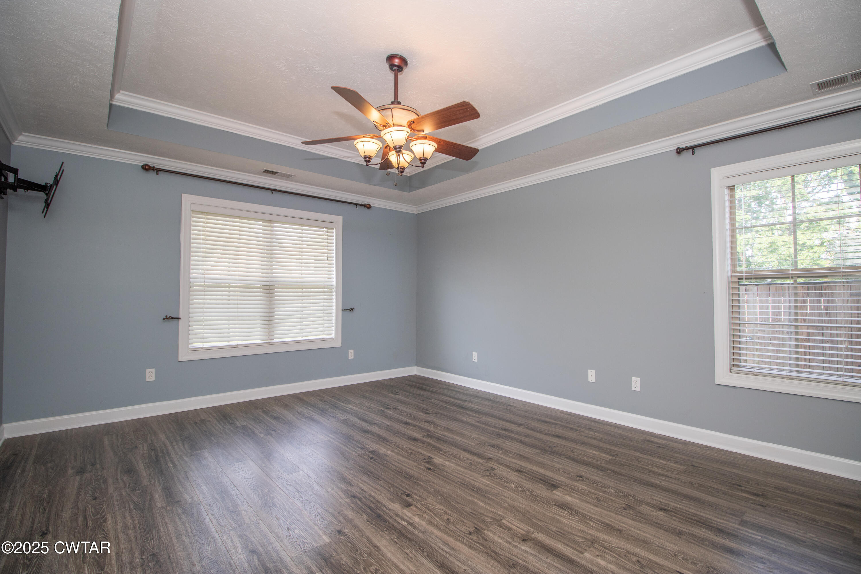 241 Stone Ridge Cove Medina, TN 38355 - Photo 17 of 59 a view of an empty room with a window and wooden floor