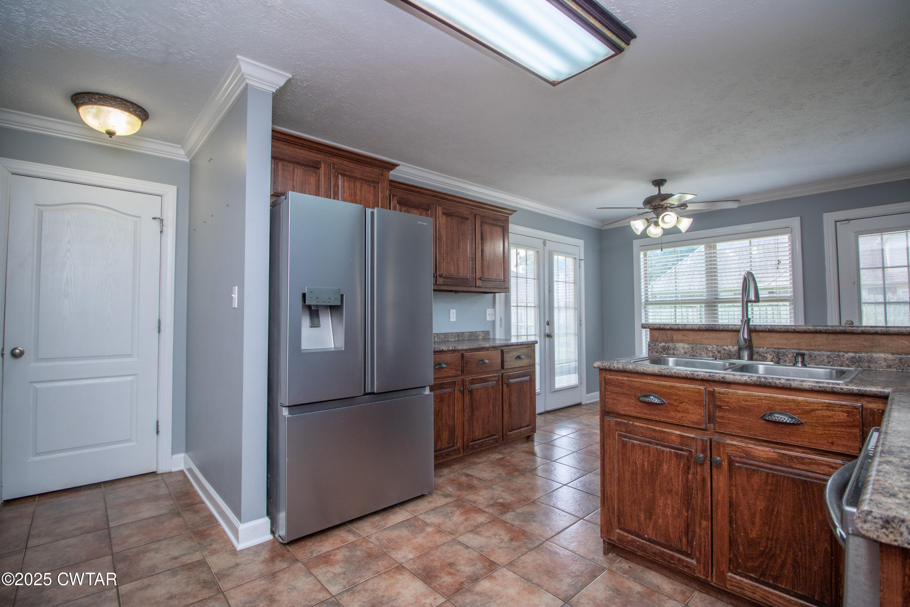 241 Stone Ridge Cove Medina, TN 38355 - Photo 31 of 59 a kitchen with stainless steel appliances granite countertop a refrigerator and a sink