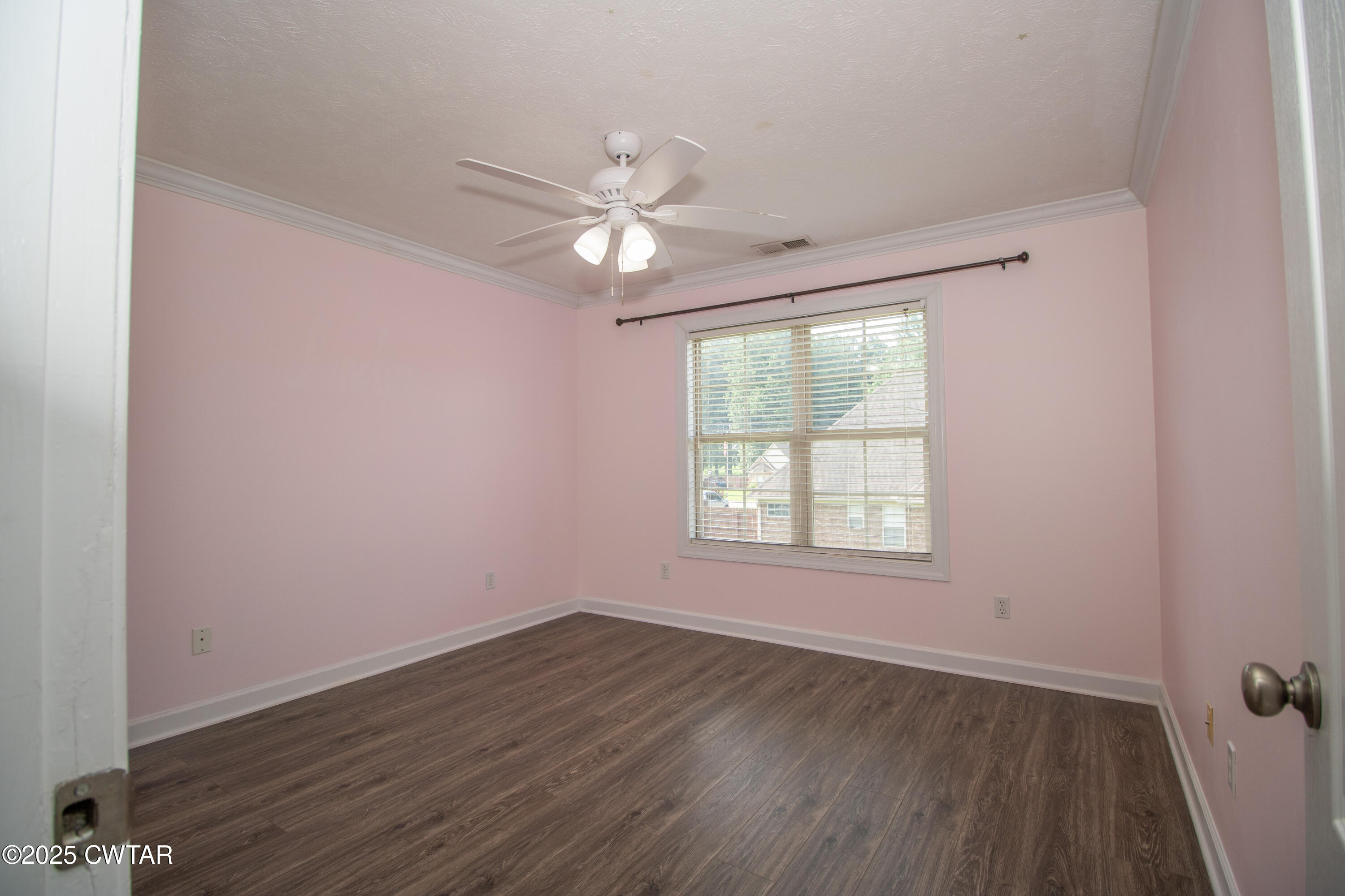 241 Stone Ridge Cove Medina, TN 38355 - Photo 35 of 59 an empty room with wooden floor fan and windows