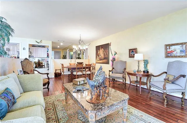 a living room with lots of furniture and a rug