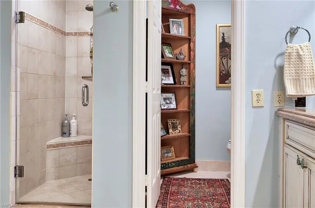 a bathroom with a shower and a sink
