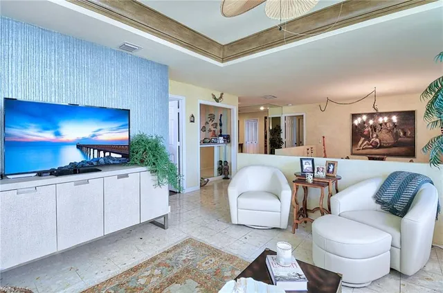 a living room with furniture and a lamp