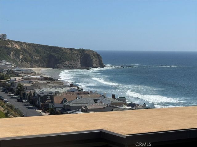 a view of ocean and mountain