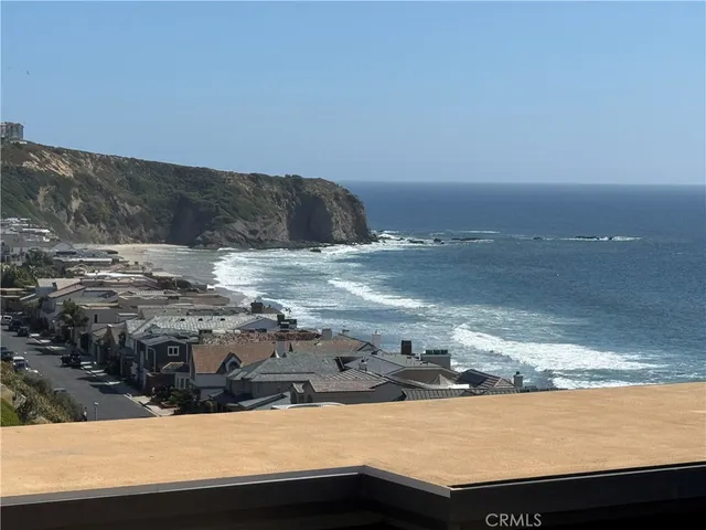 a view of ocean and mountain