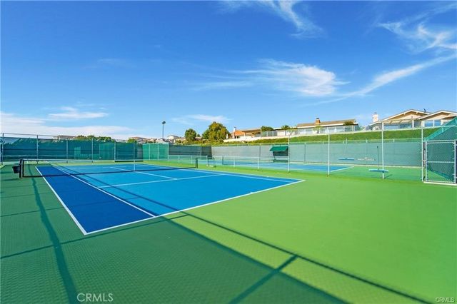a view of an outdoor space and tennis court
