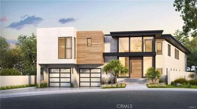 a front view of a building with a garden