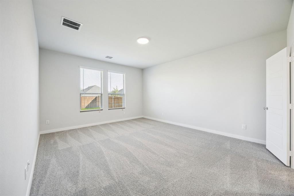 5803 Rushing River Way McKinney, TX 75071 - Photo 16 of 34 an empty room with windows