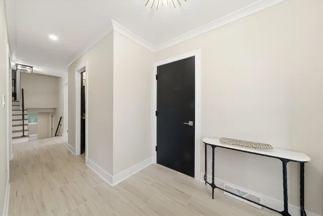 a view of hallway with wooden floor