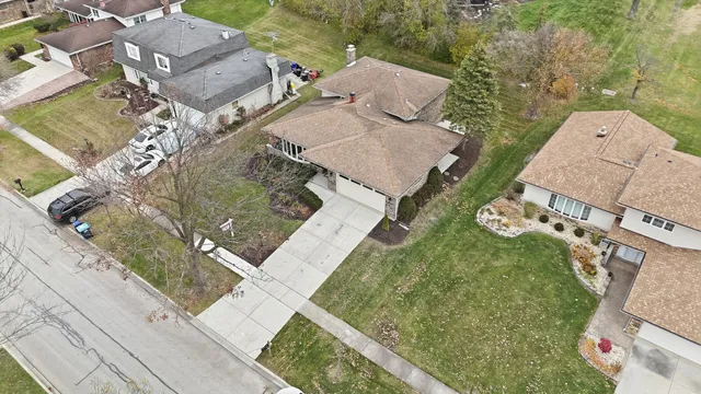an aerial view of a house with outdoor space