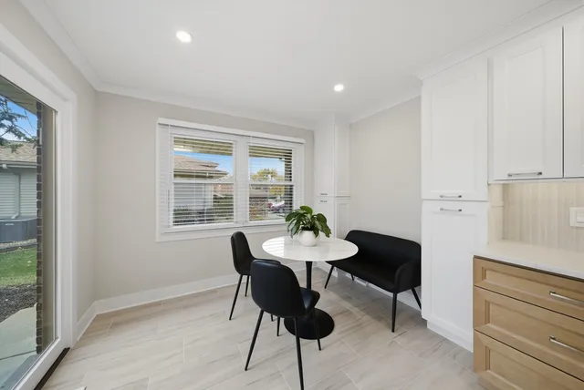 a view of a dining room with furniture window and outside view