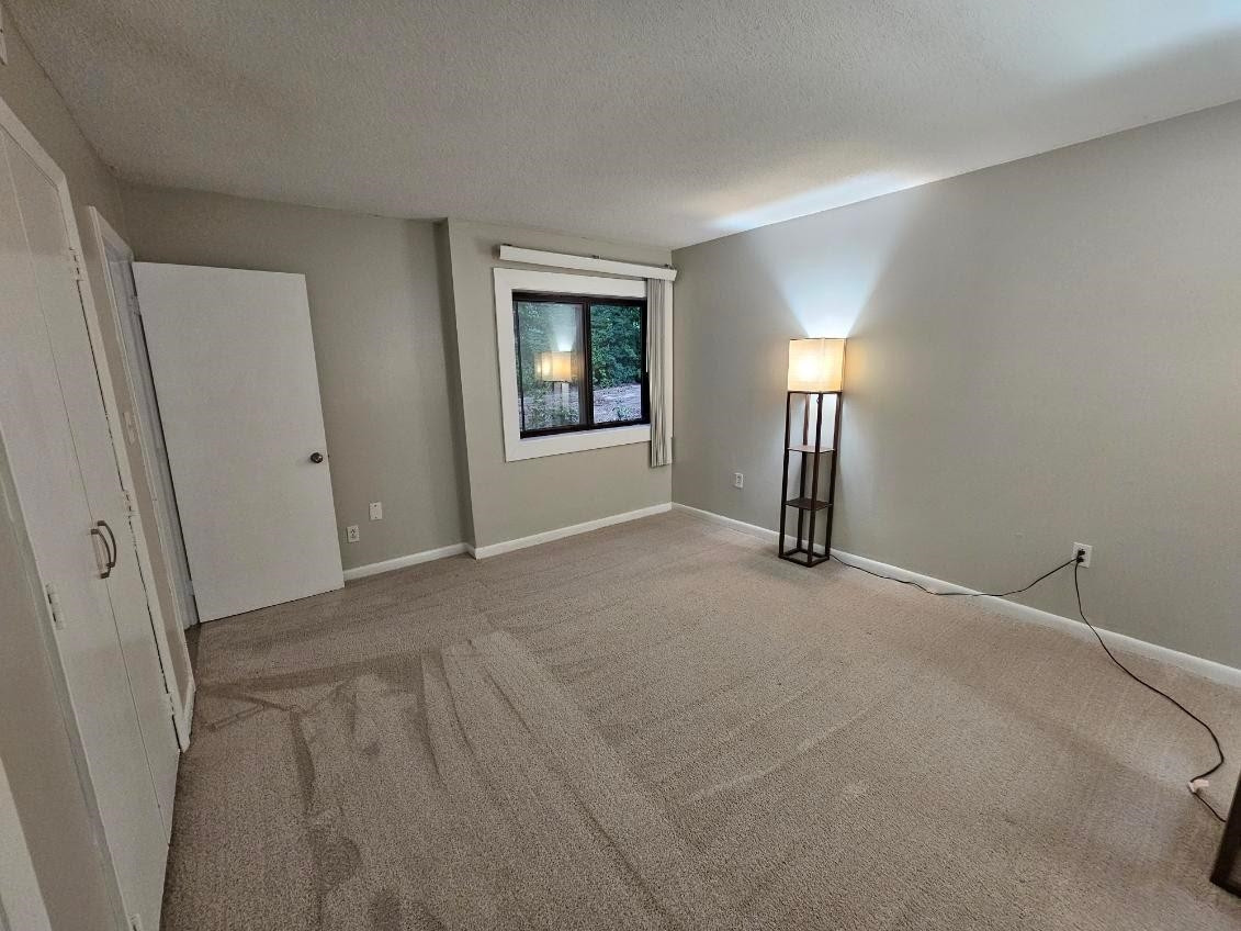 5052 Flint Ridge Place, Unit 5052 Raleigh, NC 27609 - Photo 22 of 67 a view of a livingroom with a staircase