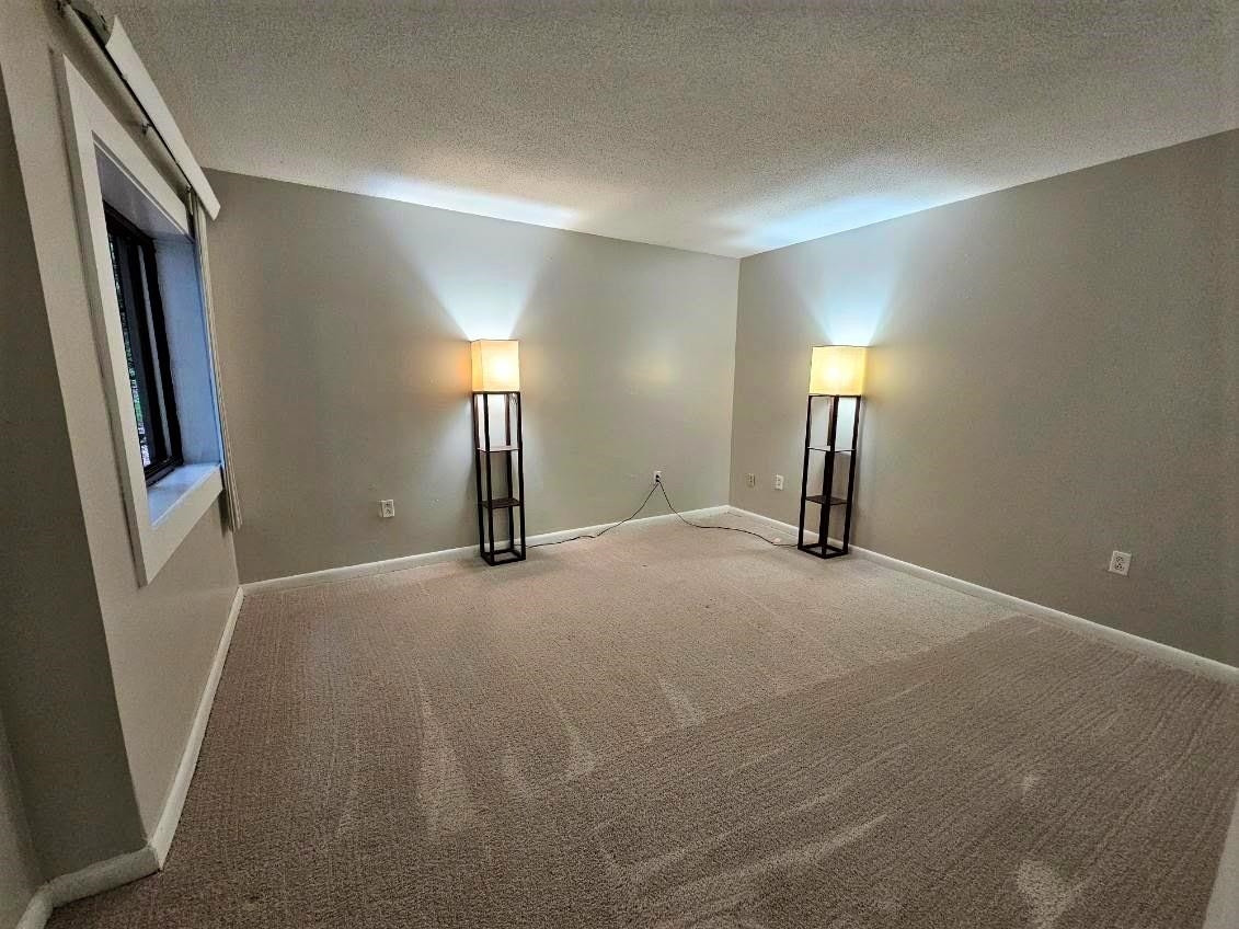 5052 Flint Ridge Place, Unit 5052 Raleigh, NC 27609 - Photo 25 of 67 a view of empty room with a fireplace