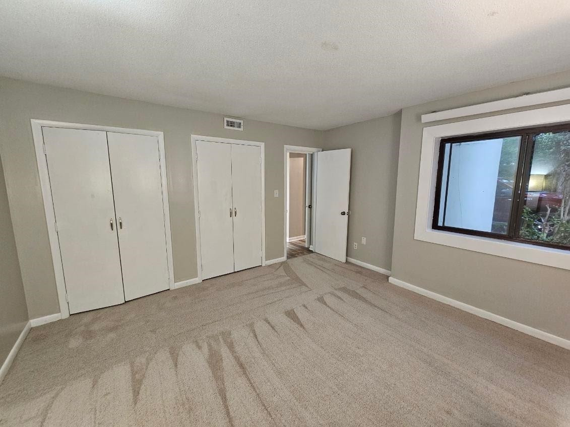 5052 Flint Ridge Place, Unit 5052 Raleigh, NC 27609 - Photo 29 of 67 a view of an empty room with a window