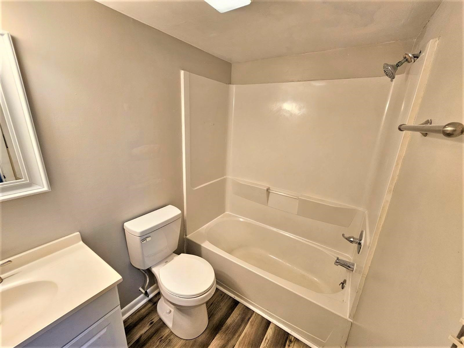 5052 Flint Ridge Place, Unit 5052 Raleigh, NC 27609 - Photo 45 of 67 a white toilet sitting next to a bath tub