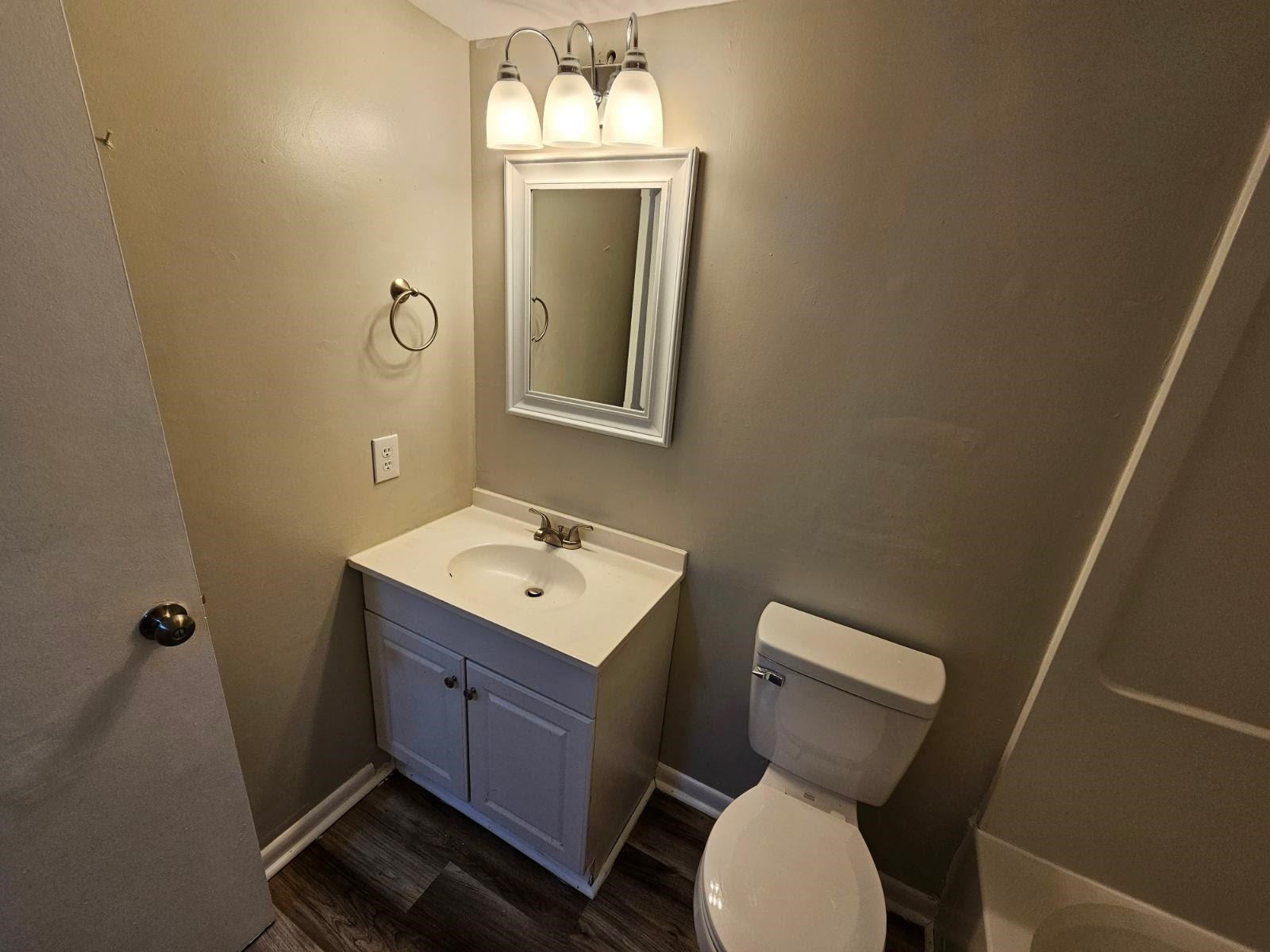 5052 Flint Ridge Place, Unit 5052 Raleigh, NC 27609 - Photo 46 of 67 a bathroom with a toilet sink and mirror