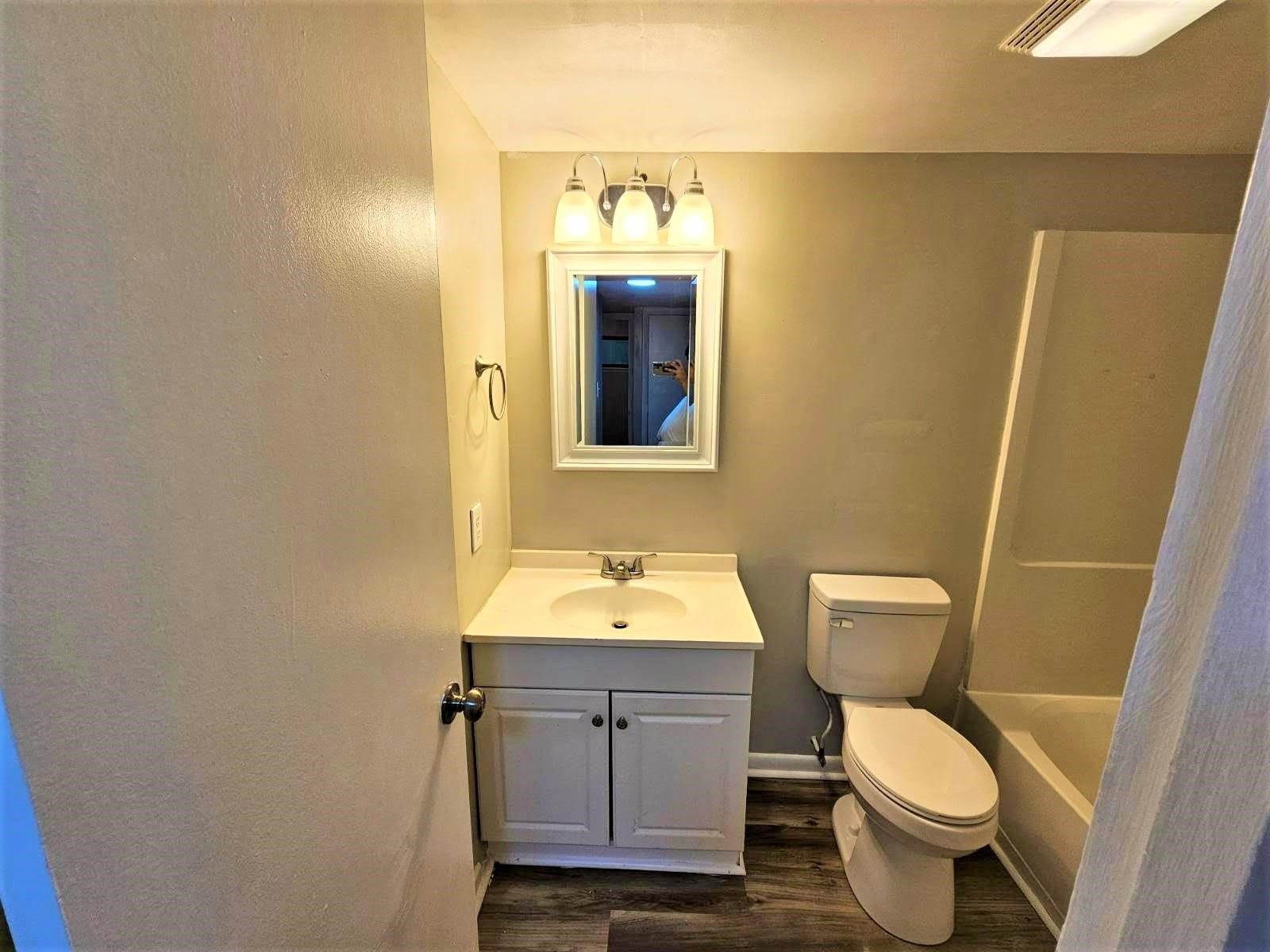5052 Flint Ridge Place, Unit 5052 Raleigh, NC 27609 - Photo 49 of 67 a bathroom with a toilet sink and mirror