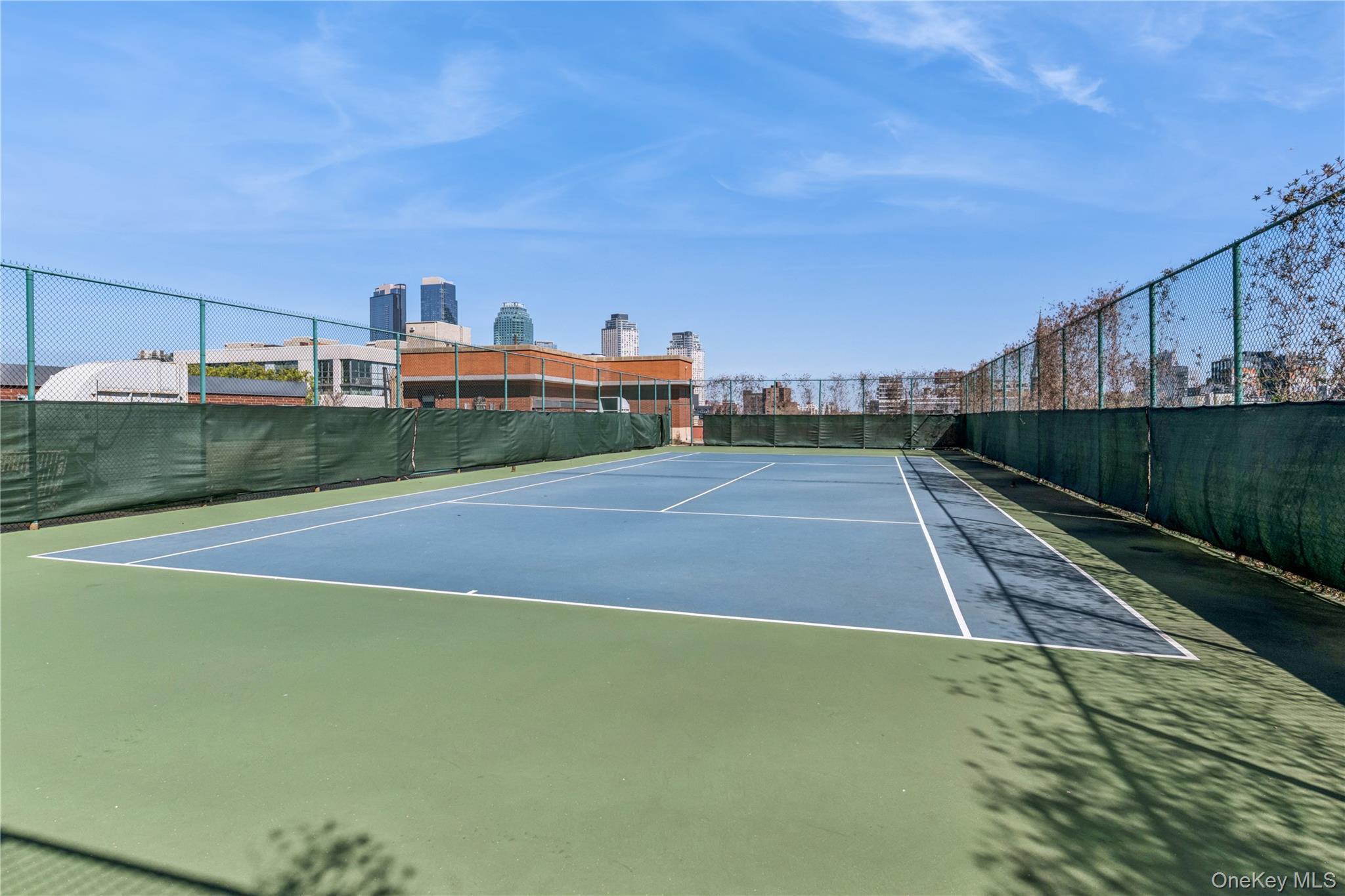 4-74 48th Avenue, Unit PH4D Queens, NY 11109 - Photo 17 of 28 a view of a tennis court