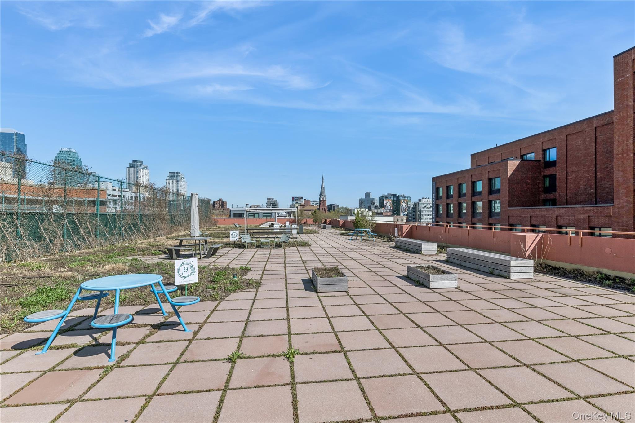 4-74 48th Avenue, Unit PH4D Queens, NY 11109 - Photo 18 of 28 a view of balcony with furniture