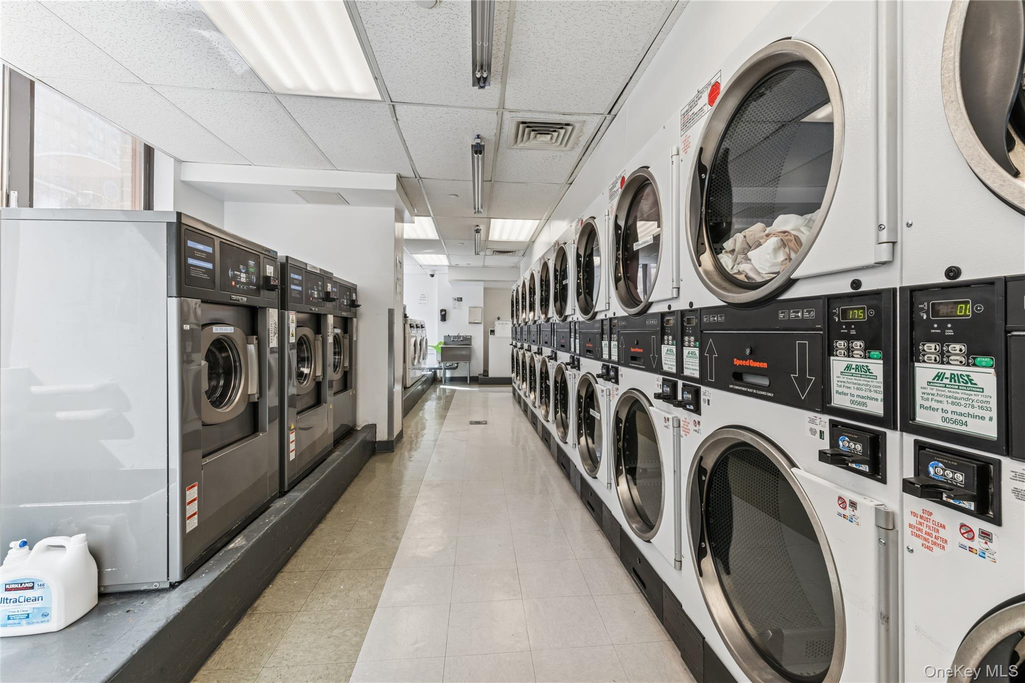 4-74 48th Avenue, Unit PH4D Queens, NY 11109 - Photo 19 of 28 a view of a washer and dryer in a room