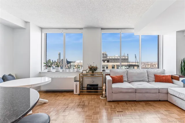 a living room with furniture and a large window
