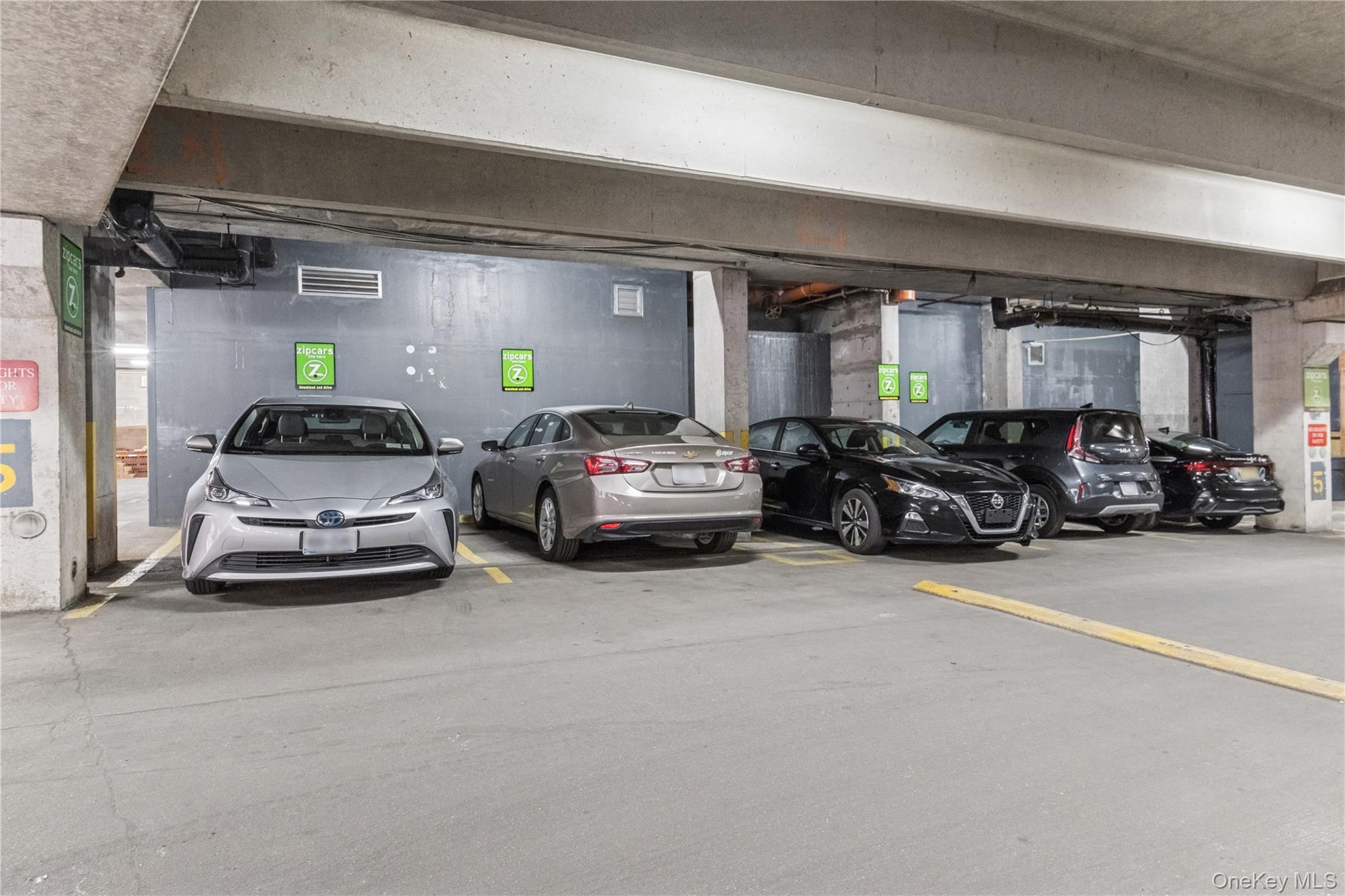 4-74 48th Avenue, Unit PH4D Queens, NY 11109 - Photo 23 of 28 a car parked in garage