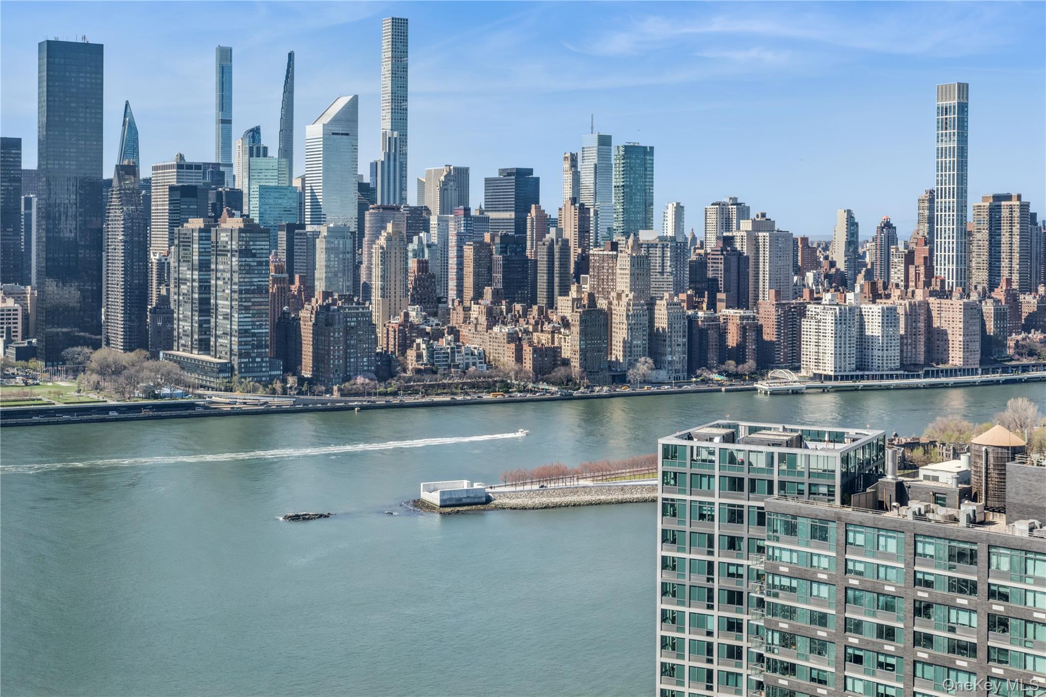 4-74 48th Avenue, Unit PH4D Queens, NY 11109 - Photo 24 of 28 a view of ocean and city view