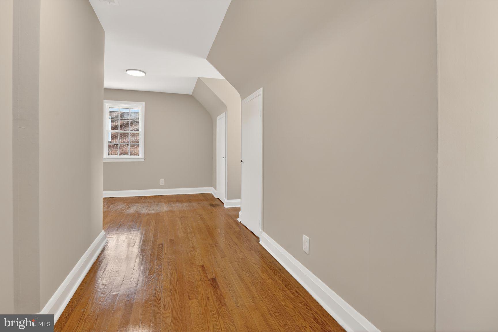 315 East Cold Spring Lane Baltimore, MD 21212 - Photo 17 of 25 a view of a room with wooden floor and a window