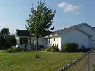 17876 Poplar Grove Road Poplar Grove, IL 61065 - Photo 5 of 6 a house view with a garden space