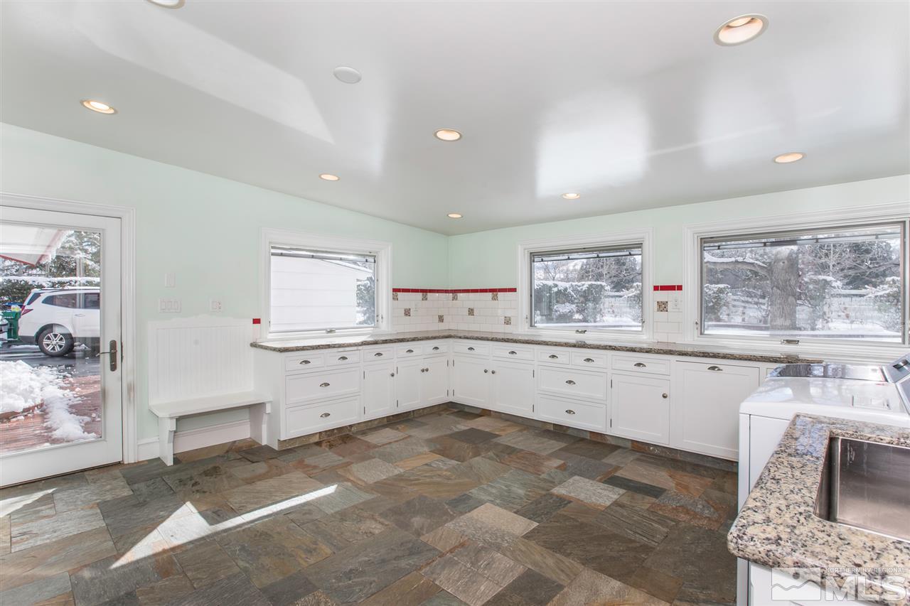 2145 Greentree Lane Reno, NV 89511 - Photo 11 of 25 a large white kitchen with cabinets