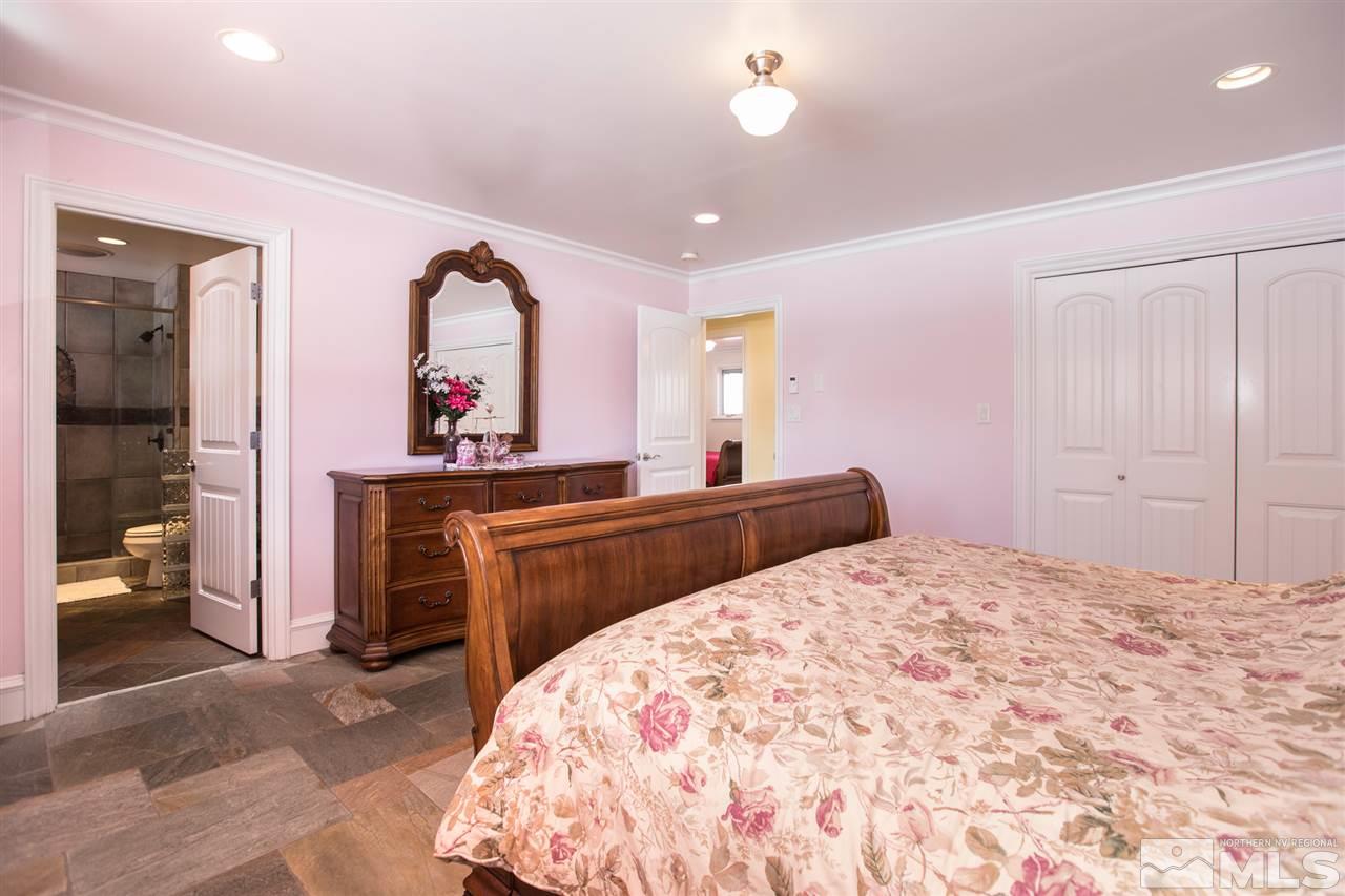 2145 Greentree Lane Reno, NV 89511 - Photo 13 of 25 a bedroom with a bed and a dresser