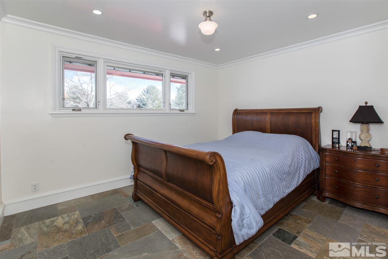 2145 Greentree Lane Reno, NV 89511 - Photo 15 of 25 a bedroom with a bed and window