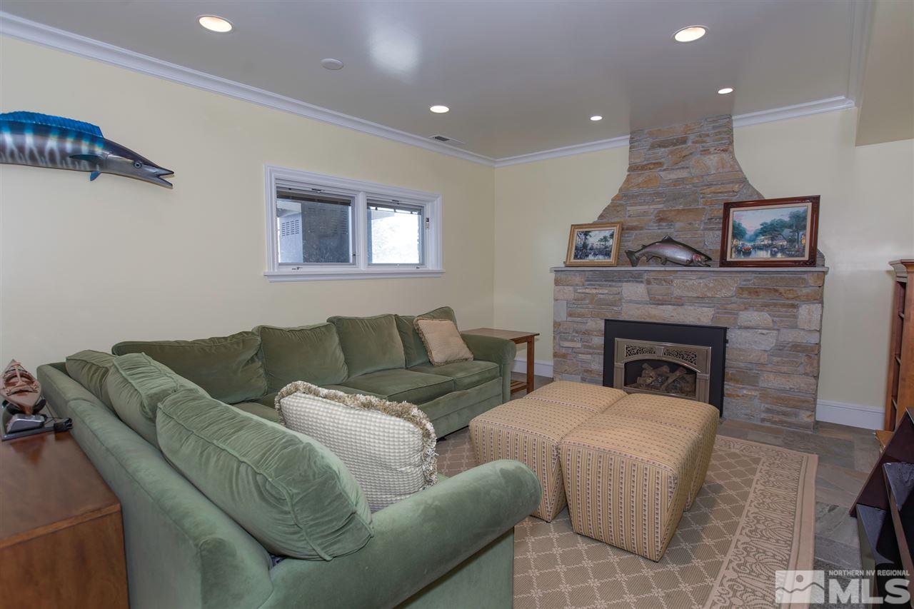 2145 Greentree Lane Reno, NV 89511 - Photo 17 of 25 a living room with furniture and a fireplace