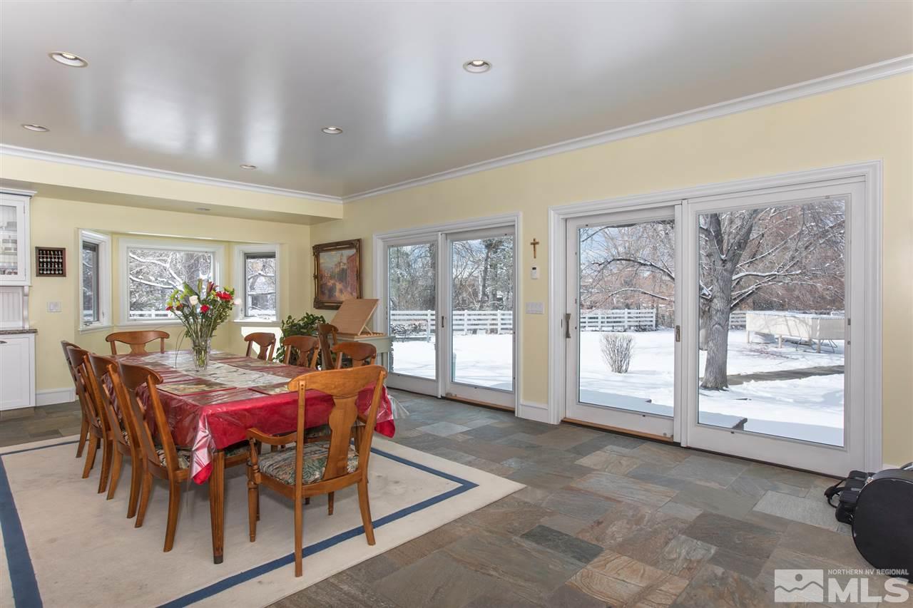 2145 Greentree Lane Reno, NV 89511 - Photo 8 of 25 a dining room with furniture a rug and a large window