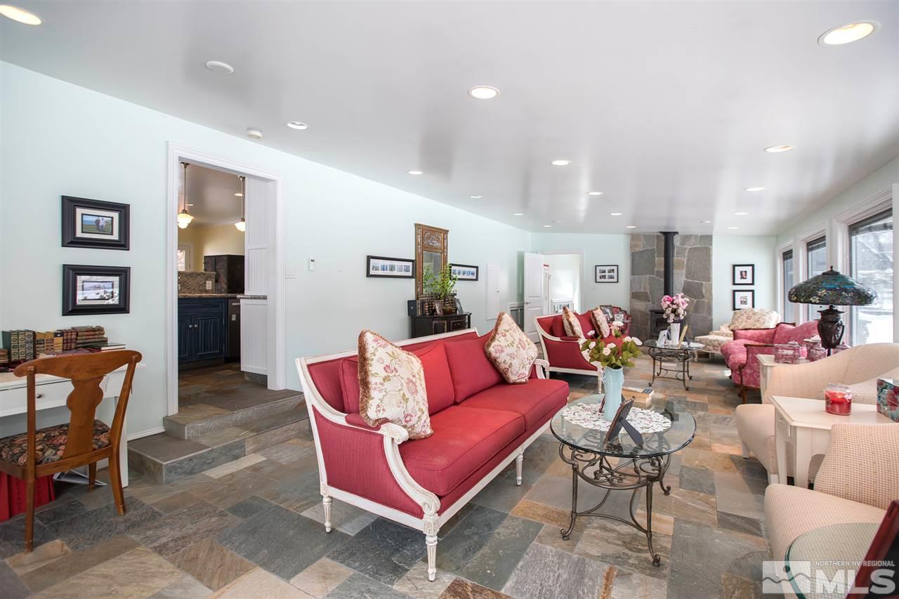2145 Greentree Lane Reno, NV 89511 - Photo 9 of 25 a living room with furniture kitchen view and a wooden floor