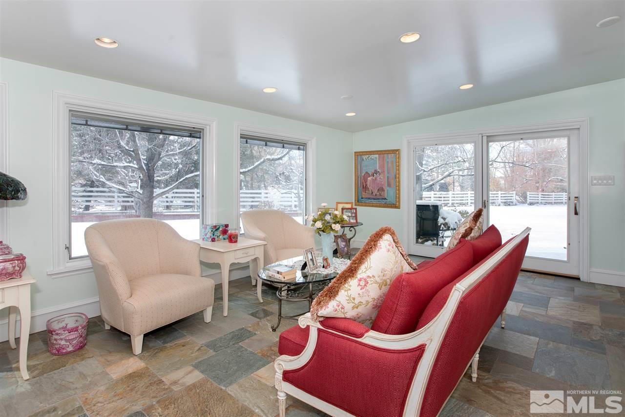 2145 Greentree Lane Reno, NV 89511 - Photo 10 of 25 a living room with furniture and a large window