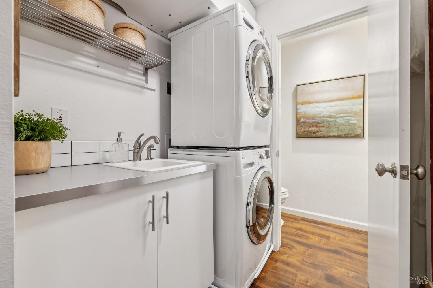 212 Sylvia Way San Rafael, CA 94903 - Photo 29 of 52 Downstairs laundry area with sink and storage