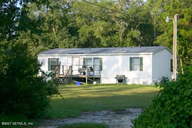 12928 Peaceful Road Jacksonville, FL 32226 - Photo 1 of 1 a view of a house with backyard sitting area and garden
