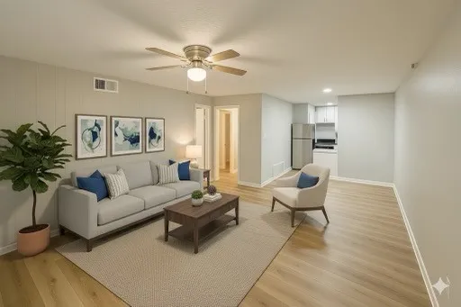 a living room with furniture and a chandelier