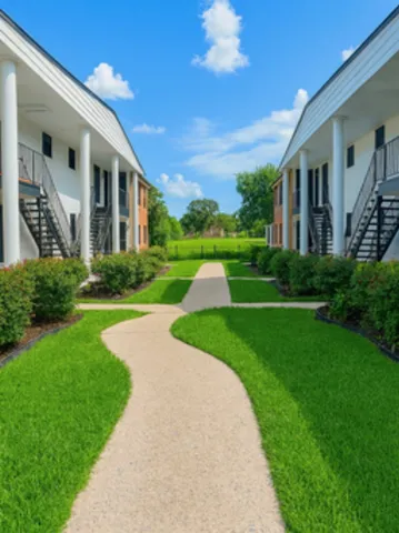 a view of a building with a yard