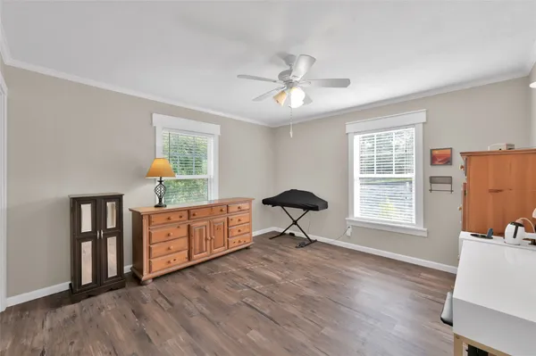 a view of a livingroom with furniture and a window