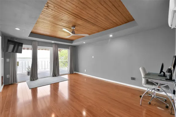 a view of a livingroom with a kitchen