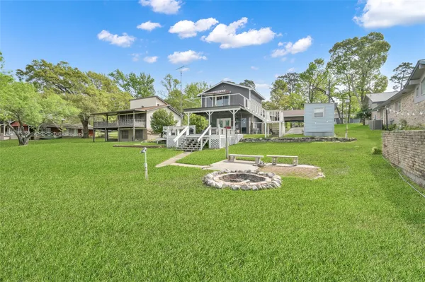 an aerial view of houses with yard