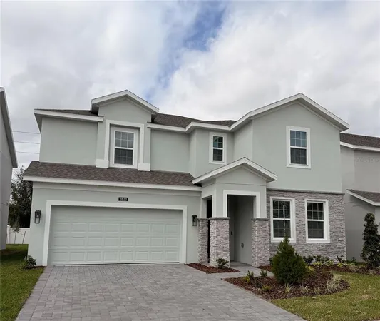a front view of a house with garage