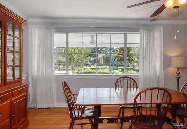 a view of a dining room with furniture window and outside view