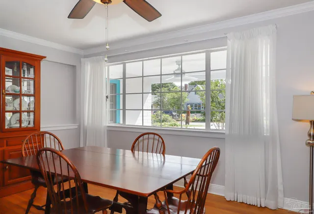 a view of a a dining room with furniture window and outside view